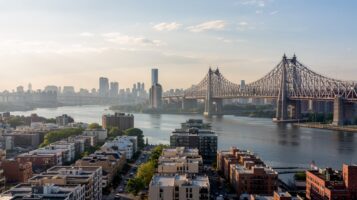 Aerial skyline of Queens NY waterfront illustrating best neighborhoods in Queens.
